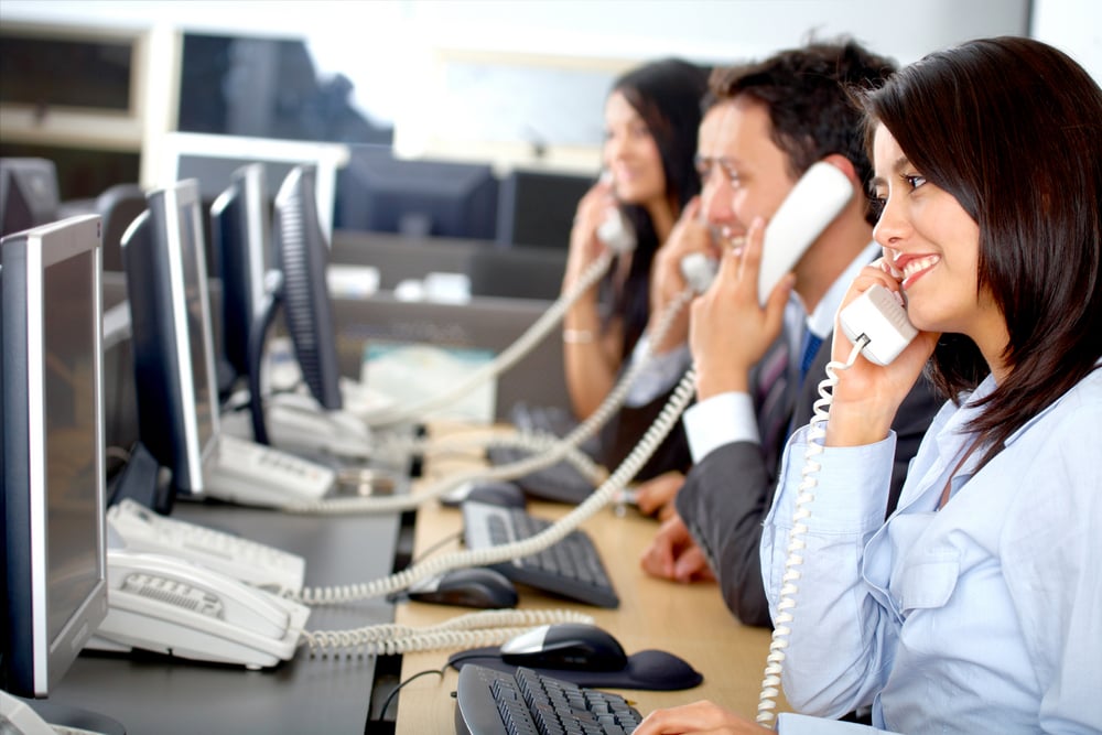 call center business team in an office full of computers