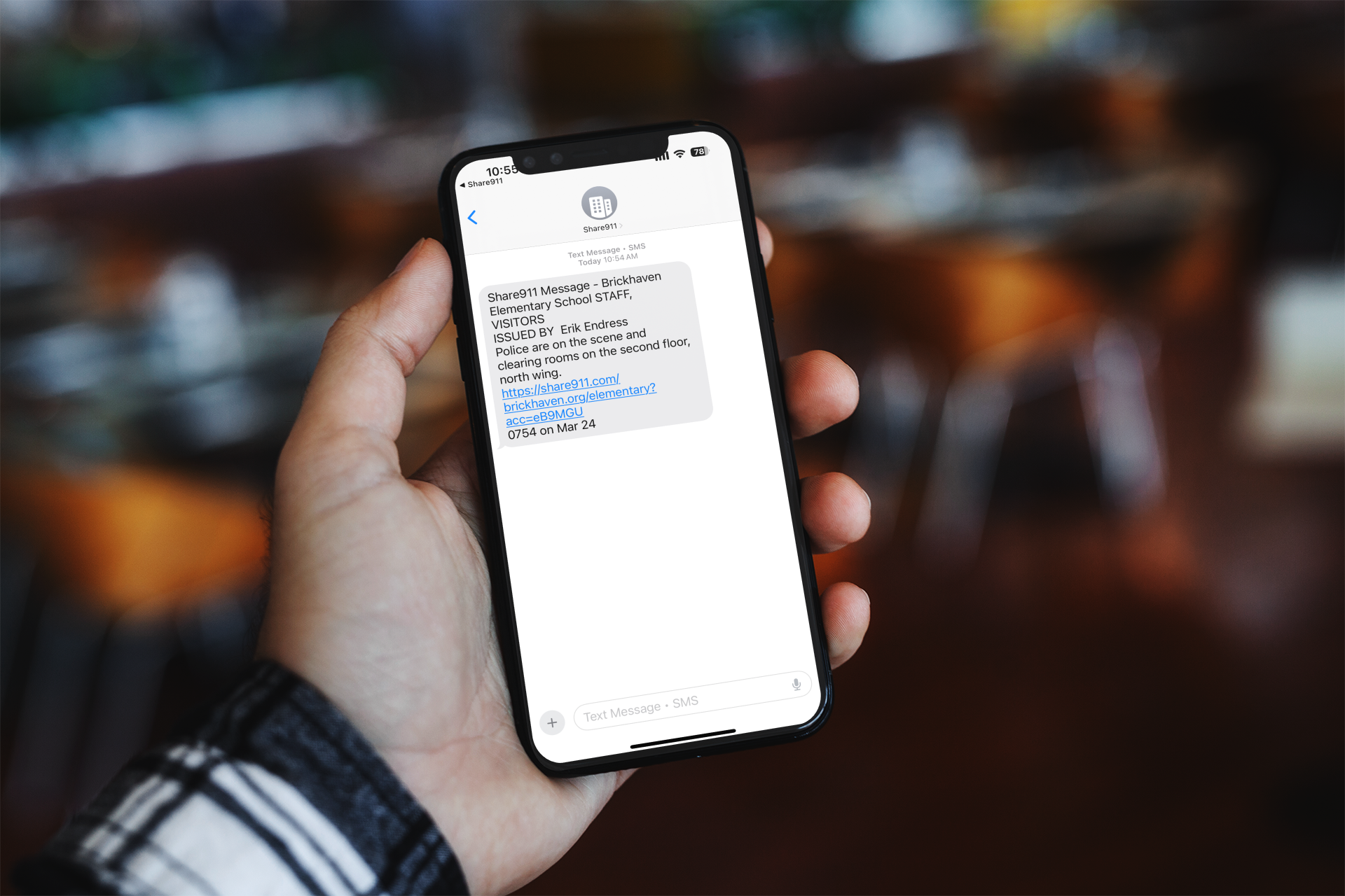 mockup-of-a-man-holding-an-iphone-11-pro-against-a-blurry-background-2124-el1 (2)